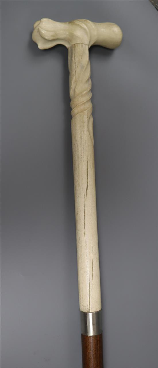 A Portuguese whalebone handled walking stick, the handle pre 1947 length 86cm